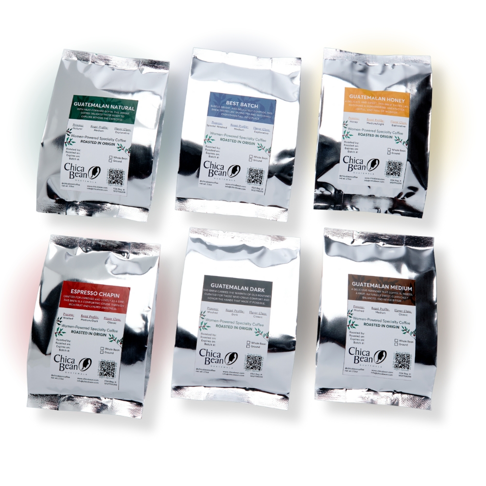 6 small silver bags, each bag with a different kind of Chica Bean coffee: Natural Process, Best Batch, Honey Process, Espresso Chapin, Dark Roast, and Medium Roast